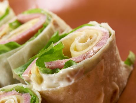 healthy club sandwich pita bread roll with cheese,ham,parsley