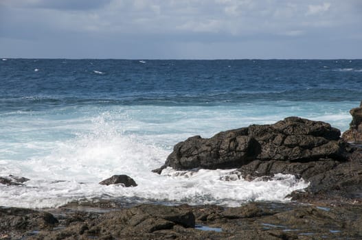 rocky beach where the waves observed