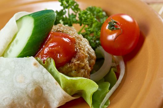 Pita Sandwich with meat,parsley,and tomato sauce