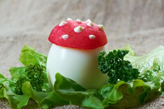 breakfast for child. mushrooms made from boiled egg ,small radish