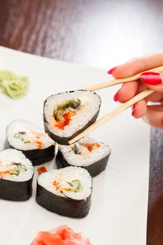 sushi with chopsticks