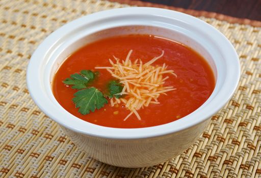 Thick and hearty tomato soup with basil.closeup