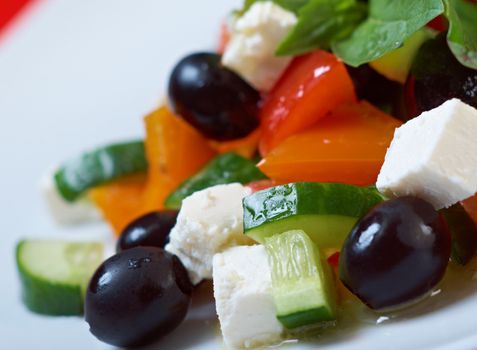 Greek salad with feta, tomatoes and black olives . selective focus