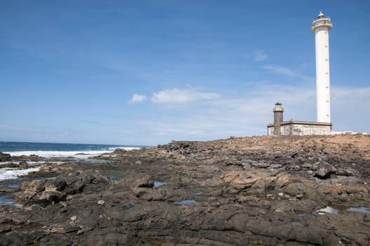 Lanzarote Harbor Lighthouse where the rocky landscape is observed