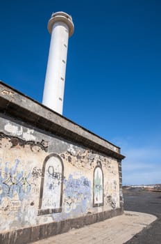 Lanzarote Harbor Lighthouse where the rocky landscape is observed