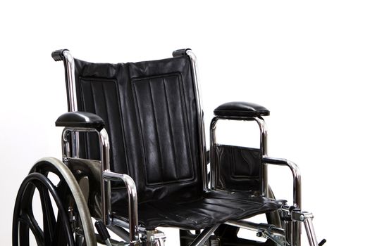 Black vacant wheelchair seat against a white background.