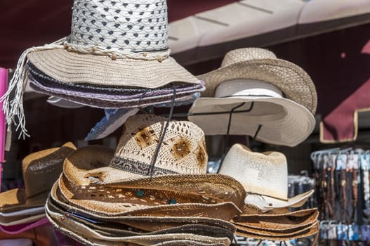 hats hanging on a rack to be viewed