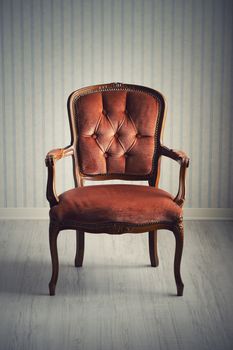 Baroque chair in an empty room