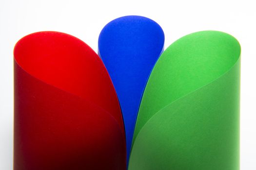 curved, colored paper in red, blue and green