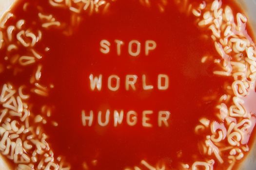 tomato soup with noodle letters message "stop world hunger"