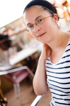 Woman sitting outside a restaurant