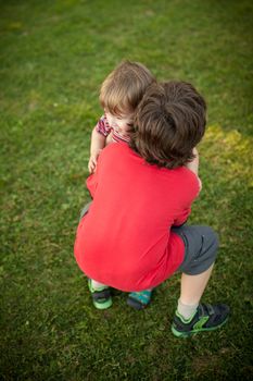 Two brothers playing together outside