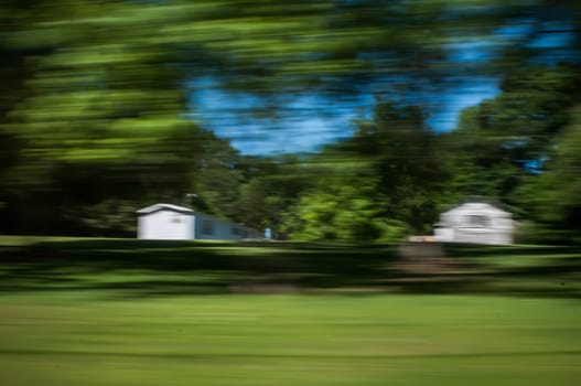 blurred out country landscape while driving