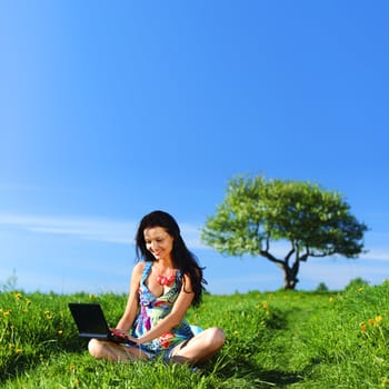 laptop work in green grass field