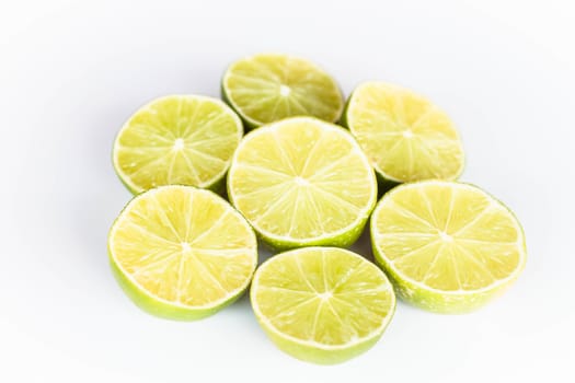 Half portion citrus lime slice on white background