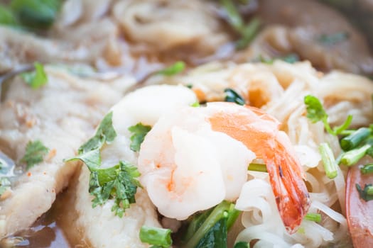 Close up shrimp topped on thai spicy noodles soup