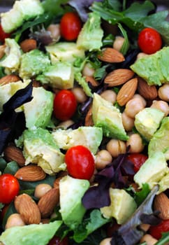 Healthy vegetarian salad with nuts, lettuce and vegetables