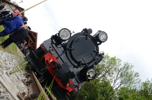 KROSNICE, DOLNY SLASK, POLAND - MAY 25: Restored narrow gauge railroad in Krosnice. Front of old locomotive before the first trip on 25 May 2013 in Krosnice, Poland.