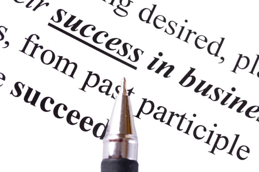 highlighted word Success in business and pen isolated