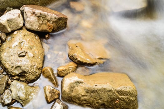 blurred water and stones background