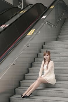 Asian beauty sit on stair, Taipei, Taiwan, Asia.