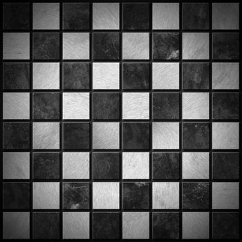 Empty metallic chessboard with dark and light gray squares 