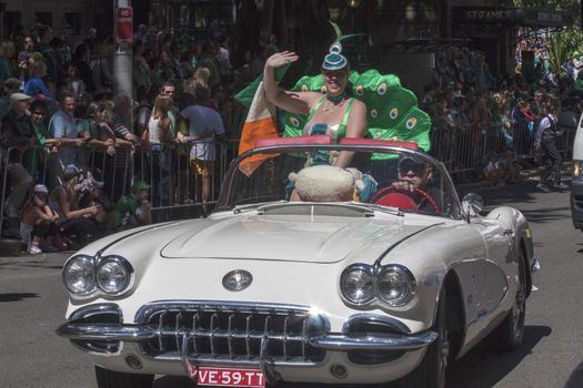 SYDNEY, AUSTRALIA - Mar 17TH: Woman in vintage Chevrolet Corvette in the  St Patrick's Day parade on March 17th 2013. Australia has marked the occasion since 1810