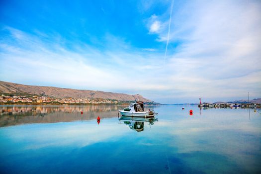 One fishing boat floating in adriatic sea island Pag, Croatia.