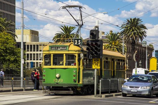 MELBOURNE, AUSTRALIA - MAR 20TH: A city circle tram waits at a stop light on March 20th 2013. The tram line is a free service that runs through the Central Business District.