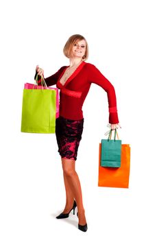 Beautiful woman with multicolored shopping bags isolated onwhite