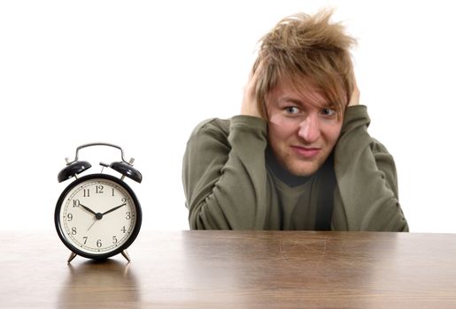 Man annoyed by the alarm clock
