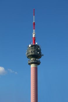 Transmitter tower against blue sky