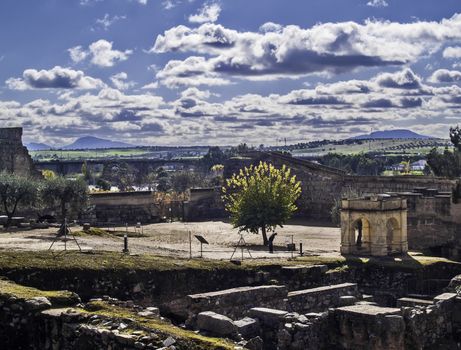 Merida, November 2012. Arab ruins inside a fortress, in Merida, capital of Extremadura region in Spain. IX century  Archeological site UNESCO World Heritage Site. A person visit the ste near a cistern building.