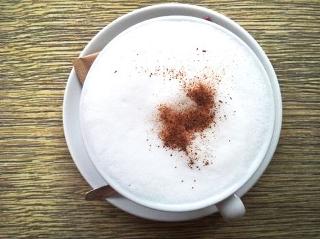 cappuccino cup on the wooden table