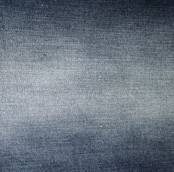Dark jeans fabric with a visible structure as a background

