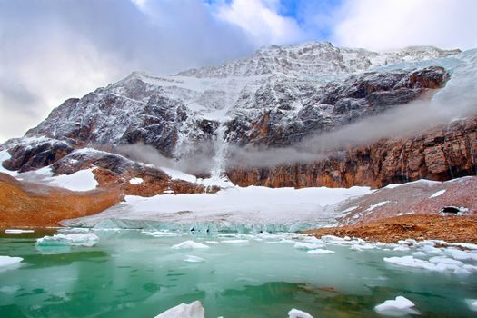 Icebergs float in glaical meltwater below Mount Edith Cavell in Jasper National Park of Canada.