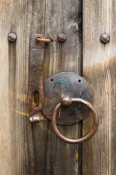 Door handle on an old wooden door