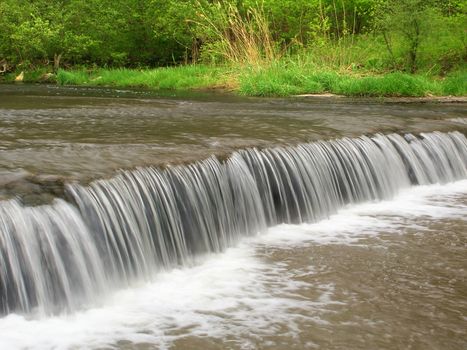 Beautiful waterfall on Prairie Creek of the Des Plaines Conservation Area in Illinois.