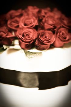 Close-up of a wedding cake decoration with roses