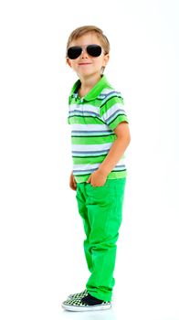 Boy with sunglasses and wearing green clothing. Isolated on white background