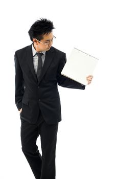 Businessman holding blank book for editing isolated over white background