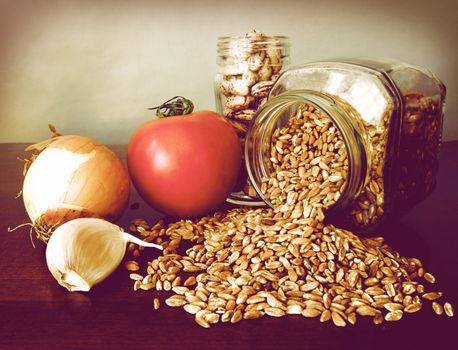 Healthy and tasteful ingredients for a soup: borlotti beans, emmer, onion, garlic and fresh tomatoes. To eat hot in winter and cold in summer. Emmer, farro in Italian, was the primary food of antique Romans.