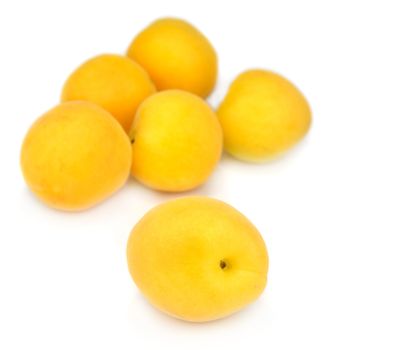 Fresh apricots isolated over white background