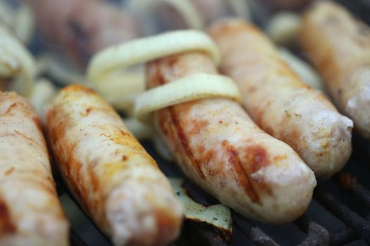 BBQ a few sausages with onion