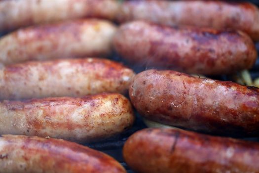 Bratwurst sausages on grill close-up