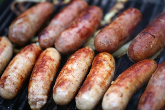 A lot of grilled sausages close up, barbecue