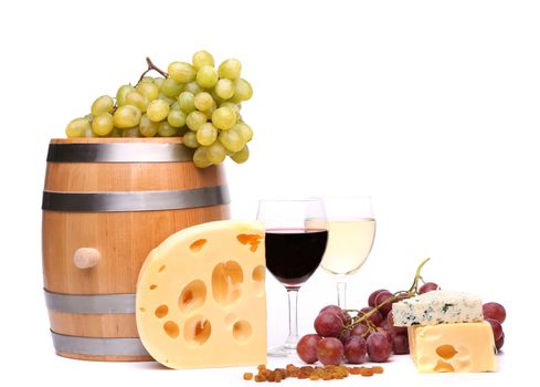 barrel, cheeses, glasses of wine and ripe grapes on wooden