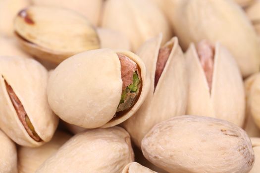 Wallpaper of pistachios with one open pistachio