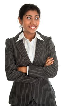 Confident Indian businesswoman hands folded in business suit smiling looking at side, standing isolated on white background. Asian female model.