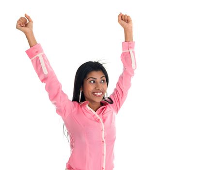 Excited Indian business woman hand raised or arms up cheering. Asian female model isolated on white background.